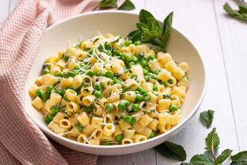 Savor the Flavors of Italy with Pasta e Piselli (Pea Macaroni): Hearty Italian Comfort Food with Creamy Green Peas, Nutty Parmesan, and Aromatic Tomato Sauce