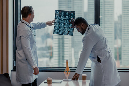 Doctors analyze MRI during breaks to plan treatment, procedures, and refer patients to specialists.