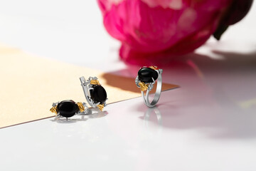 Elegant jewelry set. Jewellery set with gemstones. Jewelry accessories collage. Product still life...