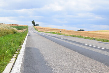 long straight country road across Eifel hills