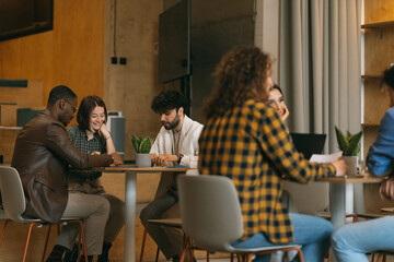 Young businesspeople working together at modern co working space