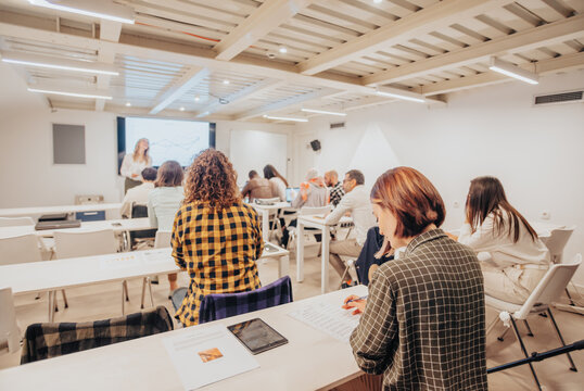 Business employees solving exam after business training