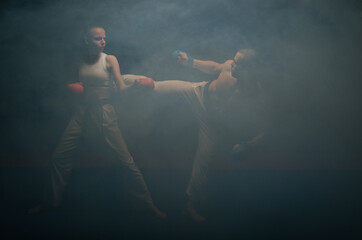Doing the Ura Mawashi Geri fight in the smoke