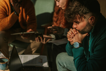 Good looking male person thinking how to solve the problems at his daily tasks at work. Close up shot