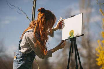Artist painting on an easel