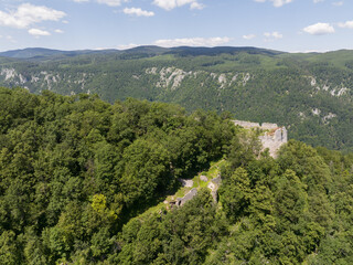 Aerial view of the ruins of the Muran Castle above the village of Muran in Slovakia