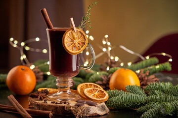 Mulled wine on table with coniferous branches