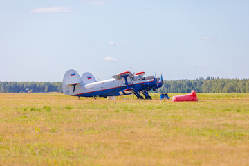 The plane on the field for skydivers.