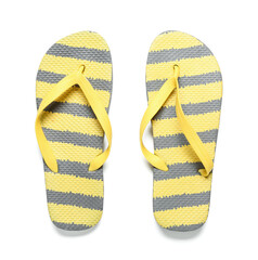 Pair of striped flip-flops on white background