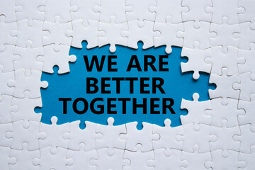 We are better together symbol. White puzzle with words We are better together. Beautiful blue...