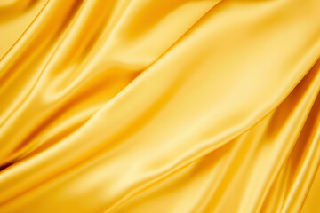 Fototapeta premium Background golden silk textile texture with lovely waves against a golden satin or silk background. High quality photo