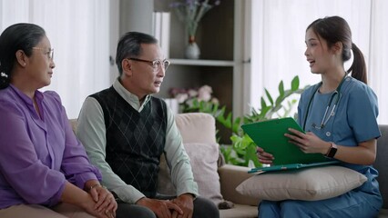 Young asian woman nurse home care checking list health care advice or prescription online on tablet to elderly lady,older people at home.homecare,health care advice,support empathy to elderly at home