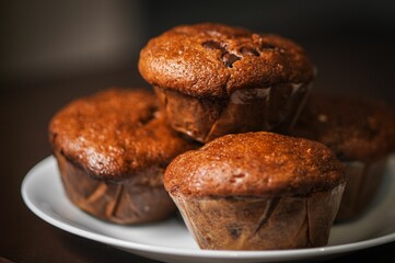 a plate topped with muffins sitting on top of a table