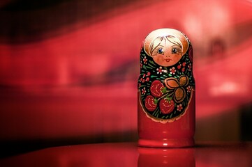 a matry doll sitting on top of a red table