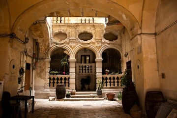 Fototapeta premium Urban street scene with an old building in Bari, Italy