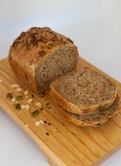 a wooden cutting board with two slices of bread on top of it