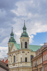 Fototapeta na wymiar old town hall with two emerald green towers
