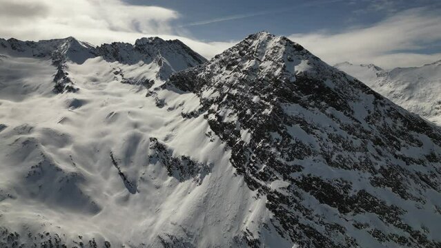 Raising drone over Hangerer glaciers in the Otztal Alps of Austria in winter