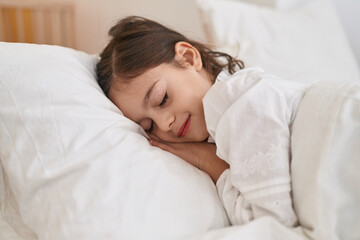 Fototapeta na wymiar Adorable hispanic girl lying on bed sleeping at bedroom