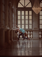 Unrecognizable couple dancing in hall