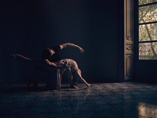 Graceful ballet dancers in dark ball room © ADDICTIVE STOCK CORE