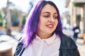 Young beautiful plus size woman smiling confident looking to the side at street