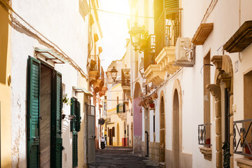 Fototapeta na wymiar Typical bright narrow street in Southern Italy