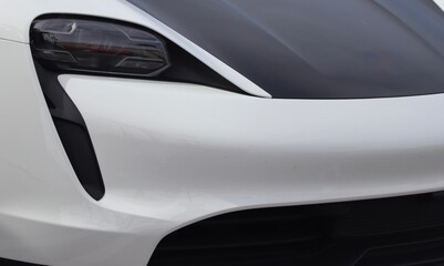 Beautiful sleek car closeup with carbon fiber inserts