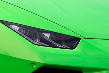 Beautiful sleek car closeup in bright green