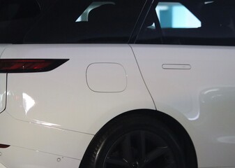 Closeup of rear on white generic car background image. 