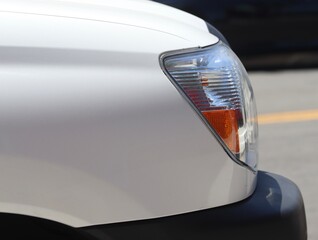 Closeup of sleek new pickup truck headlight wallpaper image. Car background image for website with LED headlights. Get up close to the modern pickup truck's stylish LED headlights in this image.