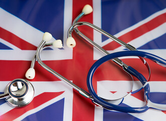 Flag united kingdom and stethoscope, public health concept