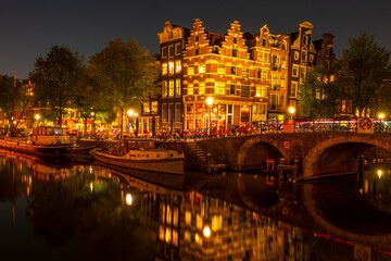 Typical Dutch Houses on the Amsterdam Canal at Night