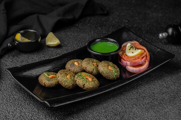 Hara Bhara Kebab on black plate
