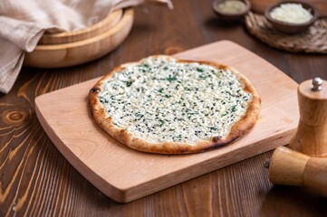 Traditional Middle Eastern spiced flatbread manaqish, topped with cheese