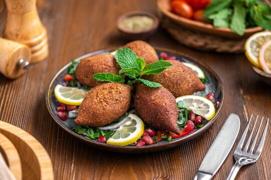 Plate of the Middle Eastern dish, kibbeh with lemons