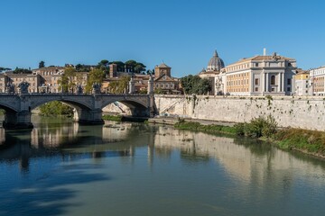 Beautiful view of a bridge over the Tiber River in Rome, Italy