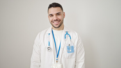 Young hispanic man doctor smiling confident standing over isolated white background