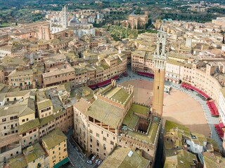 Fototapeta na wymiar Aerial view of Siena cityscape surrounded by buildings
