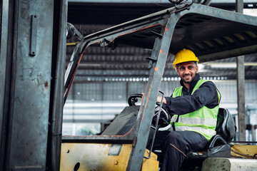 Industrious Engineer Operating Forklift in Warehouse. Efficient Forklift Driving in Factory. Engineer is working and maintaining in the factory.