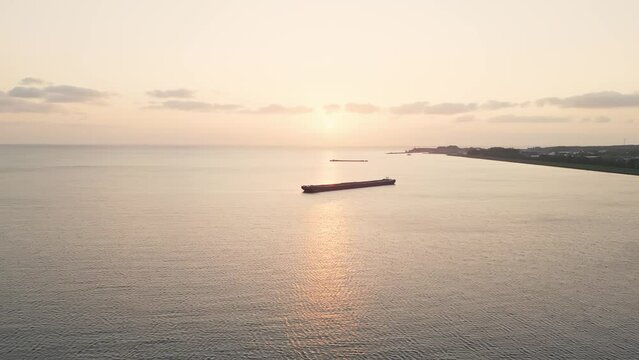 Aerial video of a long boats in the sea in the evening
