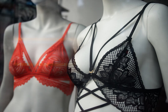 Closeup of black and orange bra on mannequin in a fashion store showroom