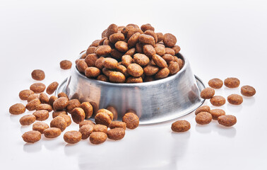  Delicious bowl of dog food balls over isolated white background