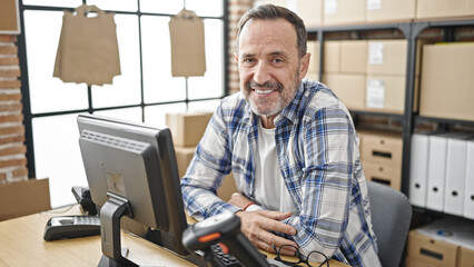Middle age man ecommerce business worker using computer working at office