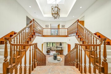 Spacious entrance to the second floor with white walls