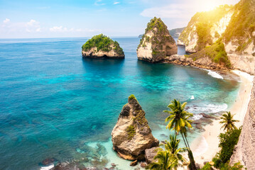 Tropical beach with white sand and palm trees, beach holiday destination on Bali island