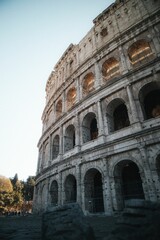 Fototapeta premium Majestic view of the Roman Colosseum illuminated by the golden sunlight