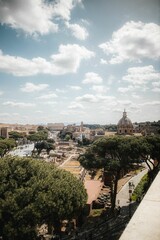 Fototapeta na wymiar Vertical shot of Rome from a balcony on a sunny day in Italy
