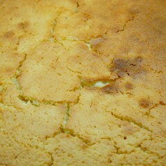 a round cornbread is shown in an oven pan with other toppings