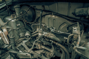 Detail of old car engine with filter effect retro vintage style.